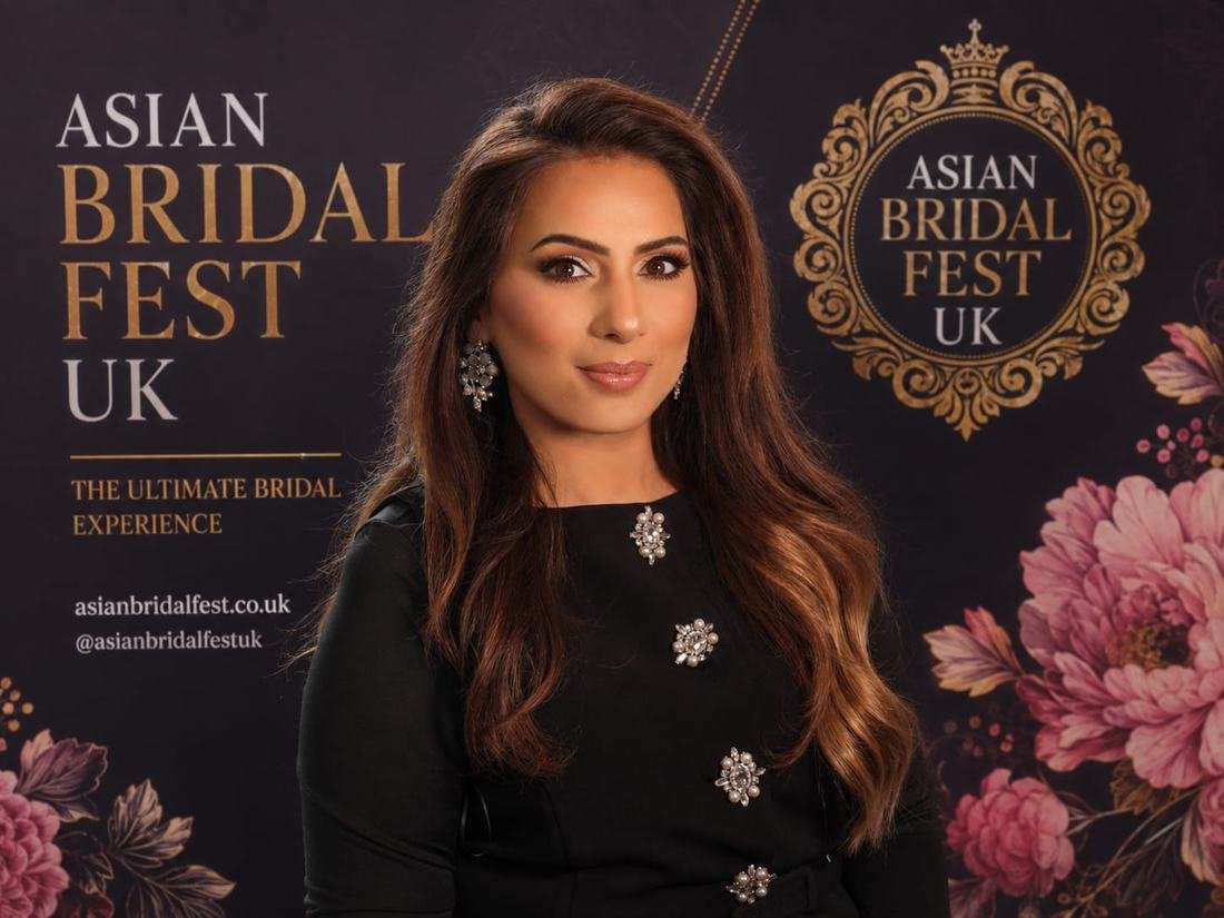 Guest photographed at the Asian Bridal Fest UK branded backdrop