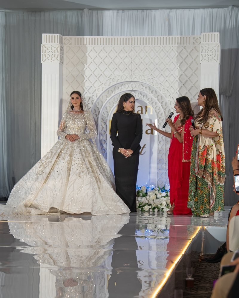 A bride in an ivory embellished gown on the runway at Asian Bridal Fest UK