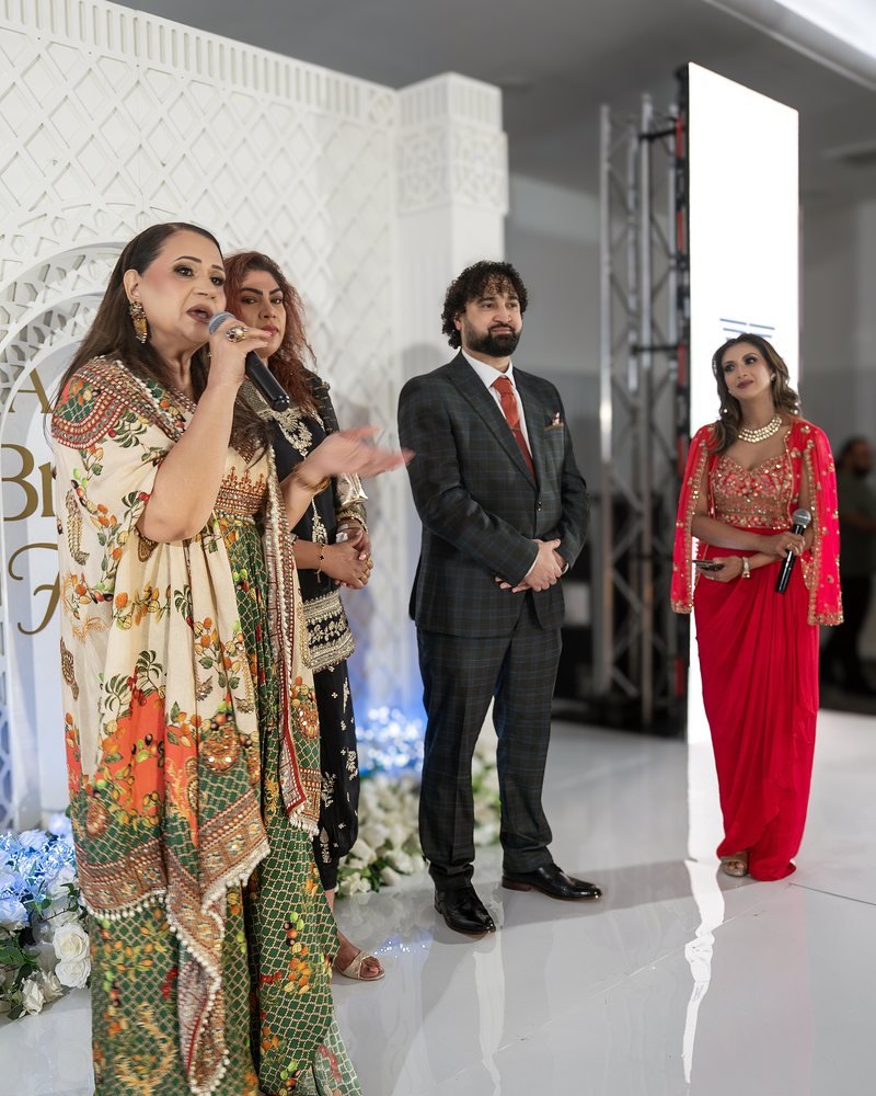Hosts and organisers speaking to the room from the Asian Bridal Fest UK stage